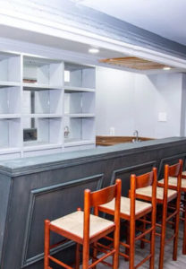 element home solutions rustic bar area with wooden chairs and shelves